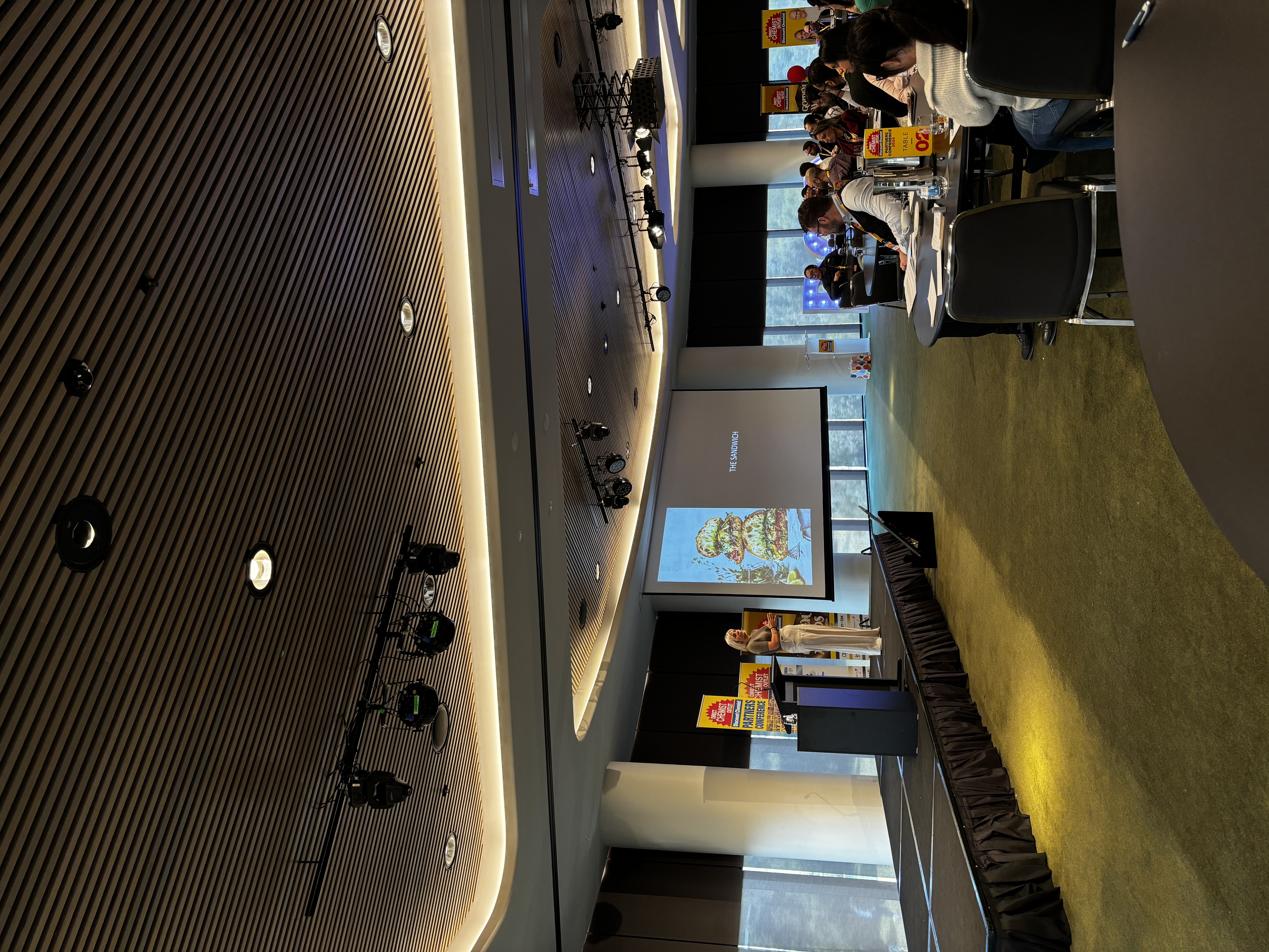 Gabrielle Roux speaking on stage